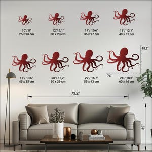 May include: A set of six red metal octopus wall decor pieces in various sizes. The octopus are shown on a white wall with measurements in inches and centimeters. The largest octopus is 24 inches wide and 18.2 inches tall. The smallest octopus is 10 inches wide and 8 inches tall.