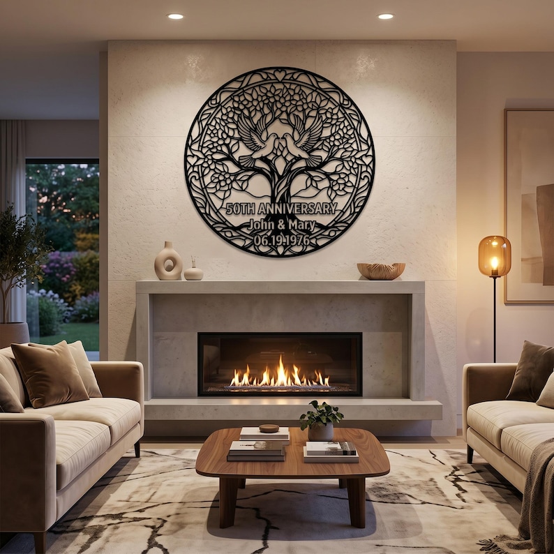 May include: A circular black metal wall art piece featuring an intricate tree of life design with two doves at the center. The text reads 50TH ANNIVERSARY, John & Mary, and 06.19.1976. The design includes decorative heart shapes and foliage.