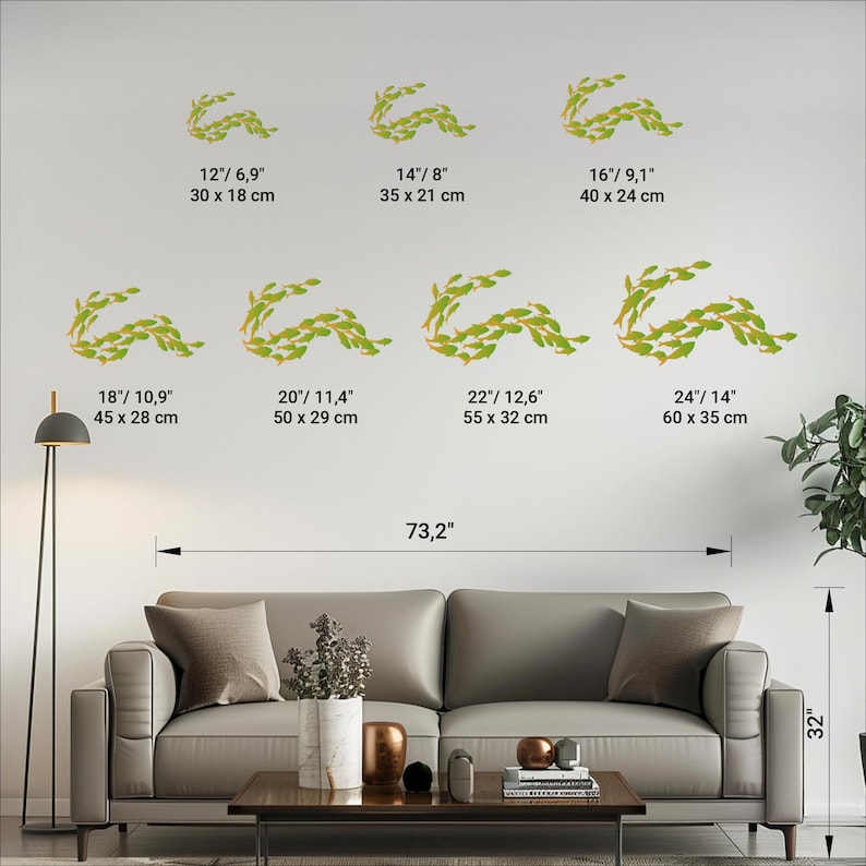 May include: A set of 8 wall decals featuring a leafy garland design in shades of green. The decals are shown in various sizes, ranging from 12 inches to 24 inches in width. The decals are shown on a white wall in a living room setting.