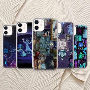 May include: Five phone cases with different designs. The cases feature images and text from the Haunted Mansion ride. The designs include cartoon characters, portraits, and the phrase "Welcome Foolish Mortals". The cases are in a variety of colours.