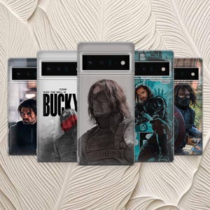 May include: A collection of five phone cases featuring images of a character with long brown hair. The cases display various portraits and graphic designs, including the text "WHO THE HELL IS BUCKY". The cases are in a row, with a light background.