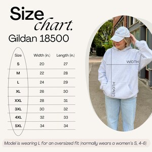May include: A light gray Gildan 18500 hoodie with a size chart. The chart shows measurements in inches for sizes S to 5XL. The model is wearing a size L for an oversized fit. The hoodie has a front pocket and a hood.