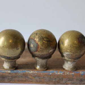 Three antique small round metal aged brass finials Architectural salvage embellishment furniture cap post top decorative supplies