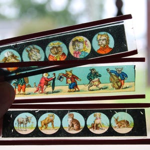 Nine Antique glass slides Animals People Ships Children Magic Lantern colored glass variety