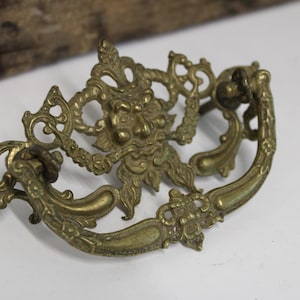 Vintage brass drawer handle 2 faces bearded Green Horned Man architectural salvage Victorian hardware supplies