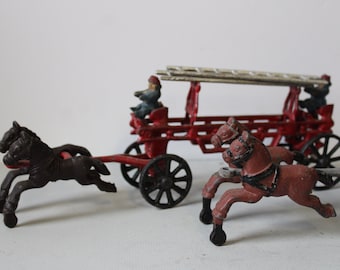 Two Vintage cast iron toy Fire trucks w/ horses fireman old fashioned fire engine