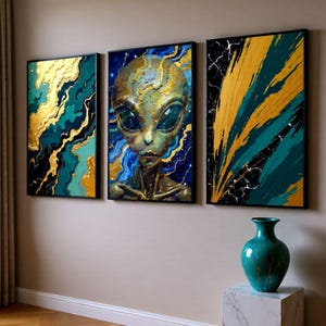 May include: Three framed abstract art prints in gold, teal, and black. The central print depicts an alien. A teal vase sits on a marble block. The text at the bottom reads "PRINTABLE WALL ART DECOR DOWNLOAD PACK."