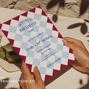 May include: A birthday invitation with a harlequin pattern in burgundy, white, and light blue. The invitation includes the text "Sophia's Birthday Paris" and details for Emily's 30th birthday celebration. The template is 5x7 inches.