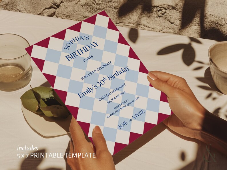 May include: A birthday invitation with a harlequin pattern in burgundy, white, and light blue. The invitation includes the text "Sophia's Birthday Paris" and details for Emily's 30th birthday celebration. The template is 5x7 inches.