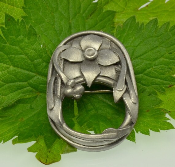 Items similar to pewter flower brooch for hanging reading glasses on Etsy