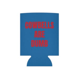 May include: Blue can cooler with the text "COWBELLS ARE DUMB" in red.