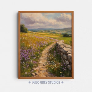 May include: A framed landscape print featuring a stone path winding through a field of wildflowers. The path is bordered by a stone wall on the right. The sky is filled with clouds, and the overall color palette is soft and natural. The text "MILO GREY STUDIOS" is at the bottom.