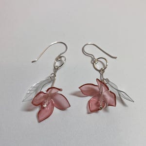 One of a kind dangle earrings handmade using pink and clear recycled plastic bottles and silver plated wire.