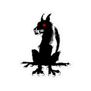 May include: A black and white sticker depicting a creature with red eyes and fangs. The creature has a furry body and is seated on a branch-like structure. The sticker has a white border, suitable for various applications.
