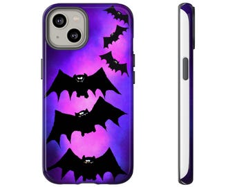 May include: A purple and pink phone case with a Halloween design. The case features black bats in flight against a gradient background. The case is shown from the front and side.
