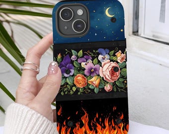 May include: A phone case with a floral design and a fiery bottom. The top section features a starry night sky with a crescent moon. The middle section displays a variety of flowers, including roses and pansies. The bottom has orange and yellow flames.