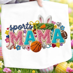 May include: White tote bag with the words "sports MAMA" embroidered in pink and teal. The design includes a basketball, baseball, football, and bunny ears. Colorful flowers and hearts surround the text.