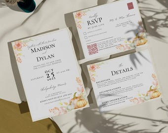 May include: Fall wedding invitation suite with a watercolor floral design featuring pumpkins and leaves. The invitation includes the couple's names, wedding date, time, and location. The RSVP card includes a QR code and the details card includes information about the reception and accommodations.