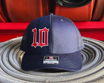 Custom embroidered Fire department hat. Navy colored richardson 112 trucker hat.