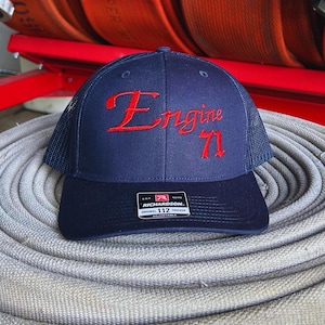 Custom embroidered Fire department hat. Navy colored richardson 112 trucker hat.