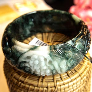 62mm Natural Grade A Burmese Jadeite Bangle Bracelet – Translucent Green & White Accents, 30mm Thick, Hand-Carved Pikul Lucky Flower Amulet