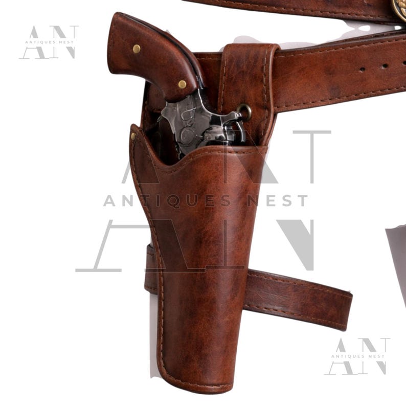 May include: A brown leather holster with a matching belt, holding a silver and brown revolver. The holster is designed to be worn on the hip. The image shows a close-up of the holster and gun, with the belt buckle visible.