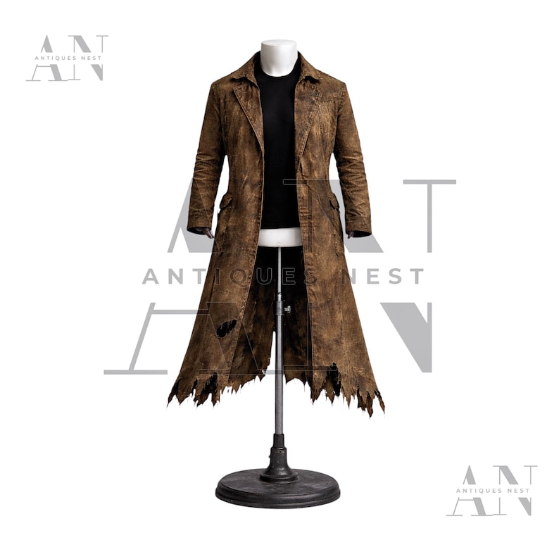 May include: A distressed brown leather coat with a tattered hemline and a black shirt underneath. The coat is displayed on a mannequin, showcasing its long length and textured appearance. The coat has two pockets and a collar.