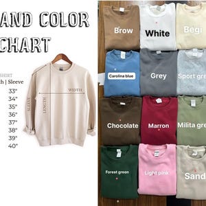 May include: A beige unisex sweatshirt with a size and colour chart. The chart lists sizes S to 5XL with measurements in inches for width, length, and sleeve. Various sweatshirt colours are shown, including brown, white, and navy.