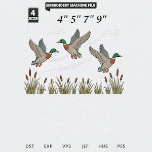 May include: An embroidery machine file design featuring three mallard ducks in flight above a patch of cattails. The text reads EMBROIDERY MACHINE FILE, 4 SIZE, 4" 5" 7" 9", and file formats DST, EXP, VP3, JEF, HUS, PES. The ducks have green, brown, and grey feathers.