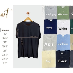 May include: A black t-shirt hangs on a wooden hanger, with measurements for width, length, and sleeve length. A size chart is on the left. Various t-shirt colours are displayed, including grey, navy, white, and pink.