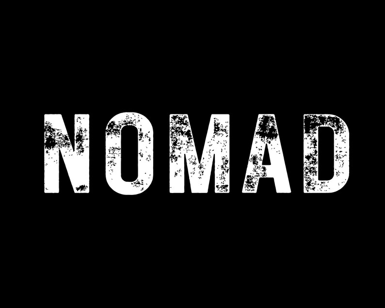 May include: The word "NOMAD" in bold, distressed white lettering against a solid black background. The letters have a textured, worn appearance, suggesting a vintage or rugged aesthetic. The design is simple and impactful.