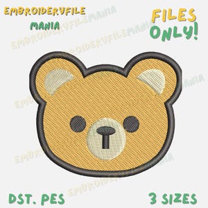 Pode incluir: Um desenho bordado de rosto de urso em tons de bege, preto e branco. O desenho é delineado em preto e apresenta o texto "FILES ONLY!" e "3 SIZES". O texto "EMBROIDERYFILE MANIA" e "DST. PES" também estão presentes.