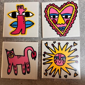Set of four hand painted ceramic tiles