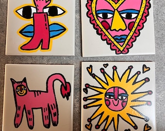 Set of four hand painted ceramic tiles