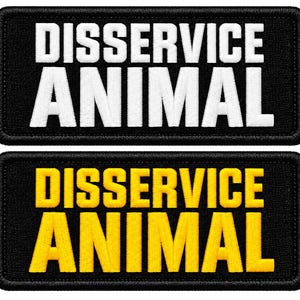 May include: Two rectangular embroidered patches with black borders. The top patch features the text DISSERVICE ANIMAL in bold white capital letters. The bottom patch features the same text DISSERVICE ANIMAL in bold yellow capital letters.