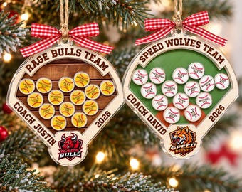 May include: Two baseball-themed ornaments with red and white gingham bows. The left ornament features a brown wood background, Rage Bulls Team text, Coach Justin, and 2026. The right ornament has a green background, Speed Wolves Team text, Coach David, and 2026.