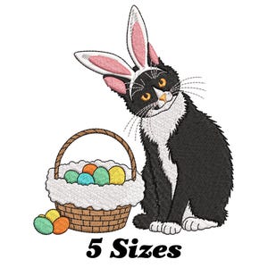 May include: A black and white cat wearing pink bunny ears sits next to a basket filled with colorful Easter eggs. The basket is made of woven brown wicker and has a white lining. The cat is looking to the left of the image.