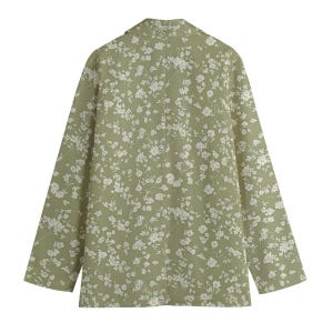 May include: A light green blazer with a white floral pattern. The long-sleeved blazer has a classic collar and a button closure. The floral print is a delicate design, covering the entire garment.