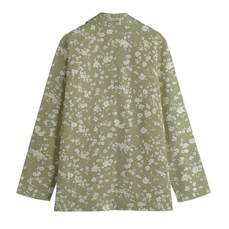 May include: A light green blazer with a white floral pattern. The long-sleeved blazer has a classic collar and a button closure. The floral print is a delicate design, covering the entire garment.