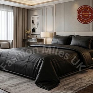 May include: A black leather bedding set featuring a quilted grid pattern on the comforter and two matching pillows. The set includes a circular logo with the text Fashion Miles UK Genuine Leather. The bedding is displayed on a bed frame.