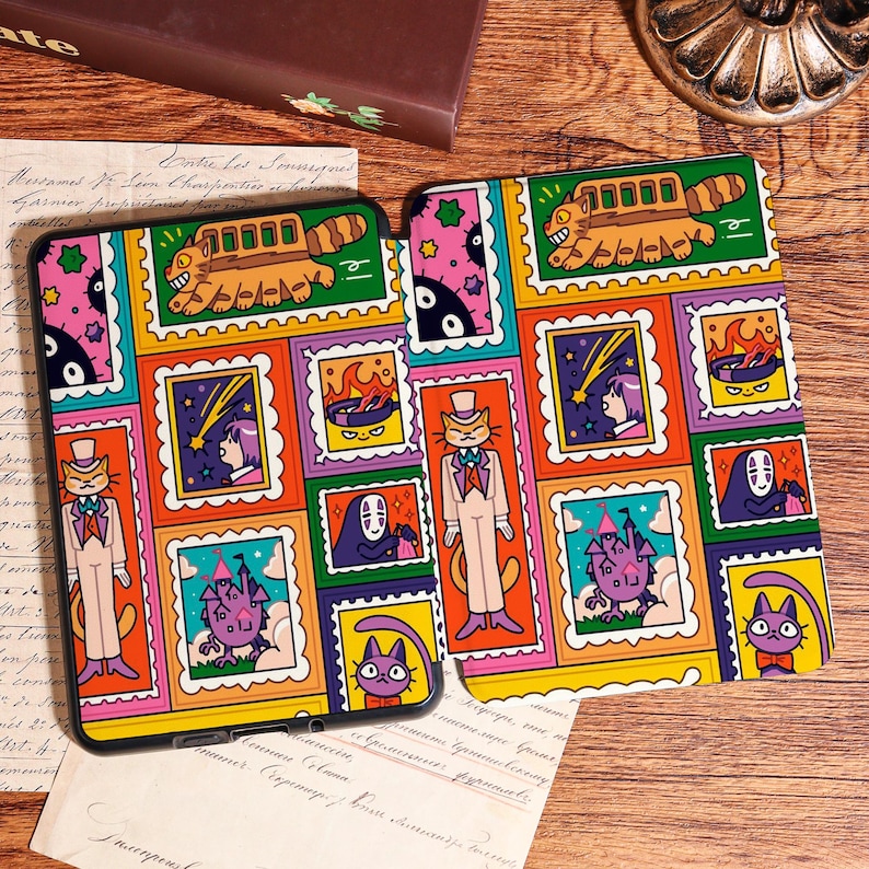 May include: Two colorful phone cases with a repeating pattern of cartoon characters in postage stamp-like frames. The design features a cat in a tuxedo, a bus-like creature, and other whimsical illustrations in a variety of bright colors.