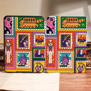 May include: Two phone cases with a colorful, patterned design featuring cartoon characters in a postage stamp style. The design includes a bus-like creature, a cat in a suit, and other whimsical elements in a vibrant color palette.