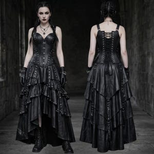 May include: A black, gothic-style dress with a corset bodice and layered skirt. The dress features studded details, straps, and a lace-up back. The model is wearing black gloves and boots, completing the dark, edgy aesthetic.
