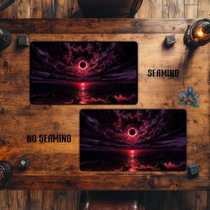 May include: Two rectangular gaming mouse pads with a dark, dramatic landscape design. The design features a red sun, dark clouds, and a body of water. One pad is labeled "SEAMING" and the other "NO SEAMING".