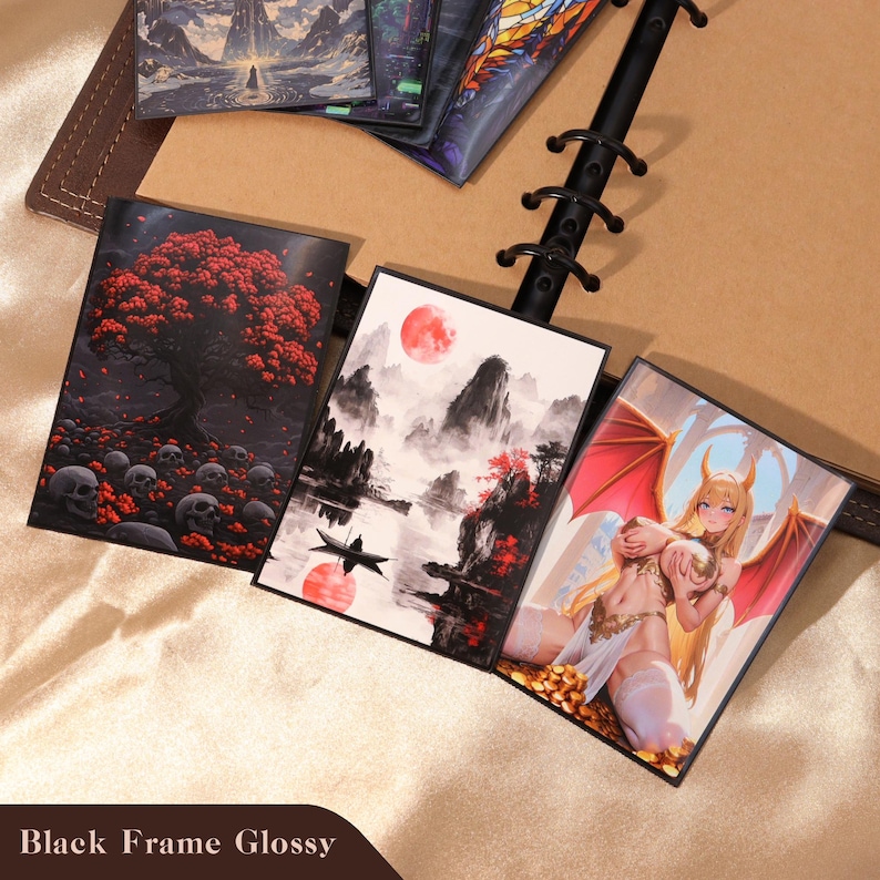 May include: Three rectangular glossy prints in black frames. The left print shows a red-leafed tree over skulls. The center print depicts a boat on water with mountains and a red moon. The right print features a blonde winged character with horns.