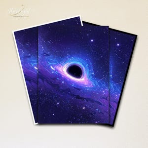 May include: Three art prints displaying a cosmic illustration of a black hole in a swirling galaxy. The artwork features a dark void surrounded by vibrant blues, purples, and white, with numerous stars. The prints have white and black borders.