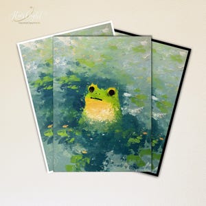 May include: Three art prints depicting a frog in a pond, rendered in a painterly style. The frog is green and yellow, amidst blue and green water and lily pads. The prints have white and black borders, with the text "Starlight HavenCrafts" in the upper left corner.
