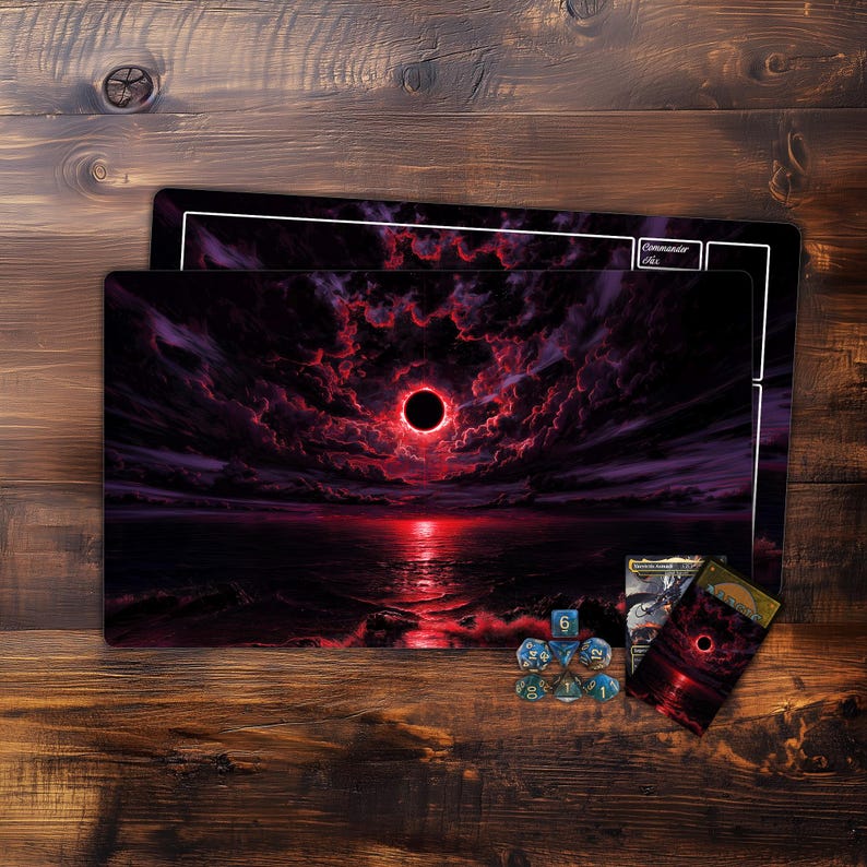 May include: A playmat and card sleeves featuring a dramatic, dark fantasy landscape with a red sun and ominous clouds. Includes dice and a card, all with matching artwork. The playmat is rectangular.