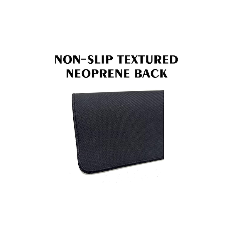 May include: Close-up of a black, textured neoprene surface. The image displays a portion of a product with the text "NON-SLIP TEXTURED NEOPRENE BACK" in bold, black letters. The surface has a diagonal ribbed pattern.