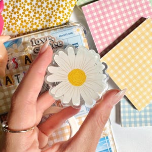 Soporte magnético para Kindle con diseño floral de margaritas: accesorio para teléfono con temática de libros.